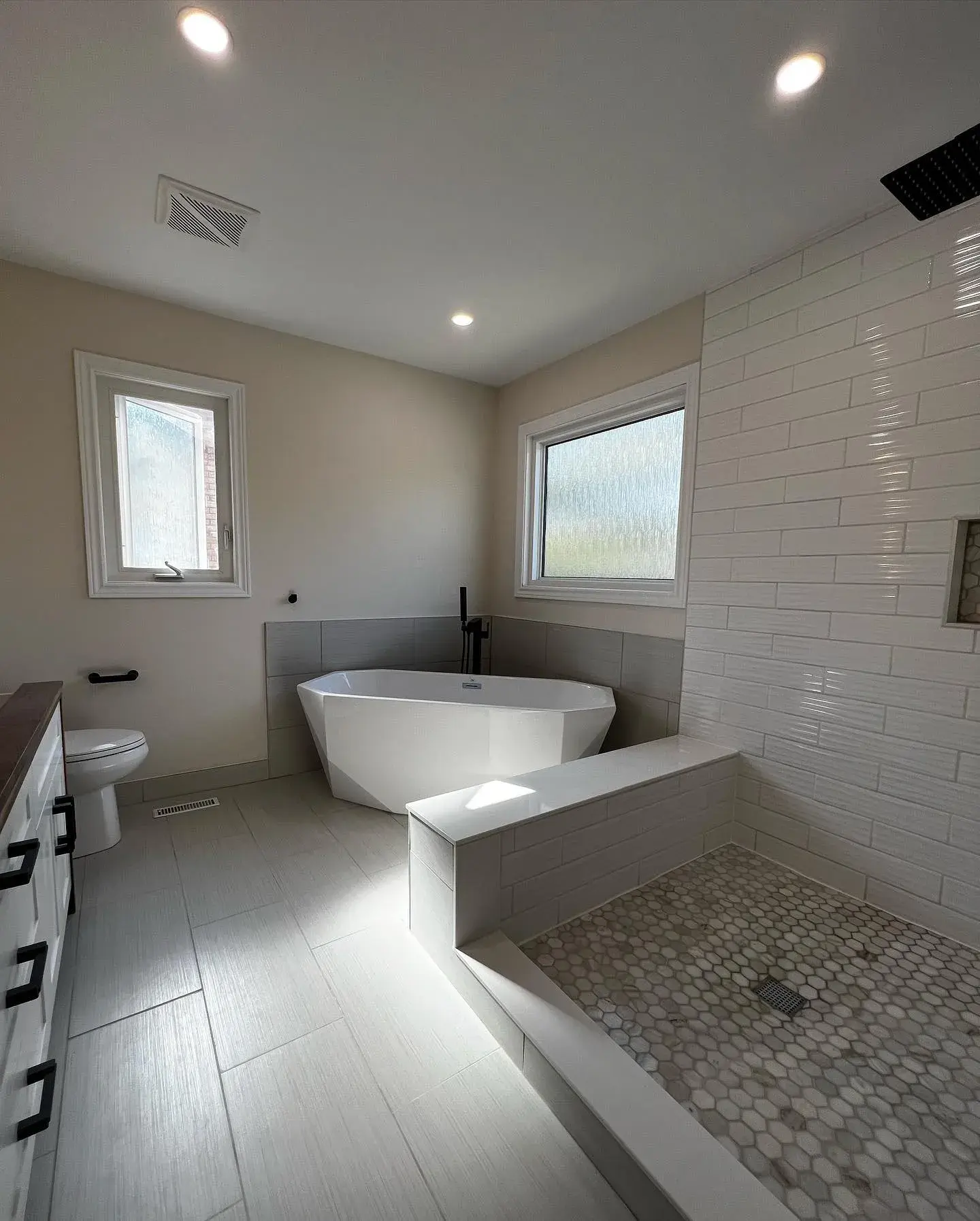 Modern bathroom with freestanding tub and walk-in shower